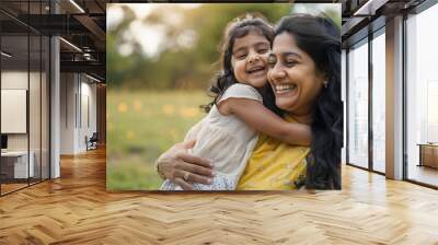 Happy indian mother having fun with her daughter outdoor - Family people and love concept - Focus on mum face Wall mural