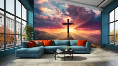 jesus christ cross easter resurrection concept christian cross on a background with dramatic lighting colorful mountain sunset dark clouds and sky and sunbeams Wall mural