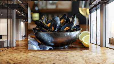 Metal bowl with mussels, lemons, and wine on table Wall mural