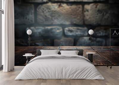 Old wood table with blurred concrete block wall in dark room background. Wall mural