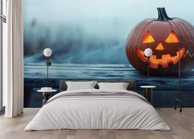 On a wooden bench with a misty gray coastal night background, a spooky halloween pumpkin, Jack O Lantern, with an evil face and eyes, rests on top of a wooden bench with a table and room for product Wall mural