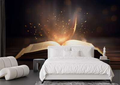 Open book Bible on wooden desk with mystic bright light fantasy light like holy spirit on black bokeh background magic poster 3d illustration Wall mural