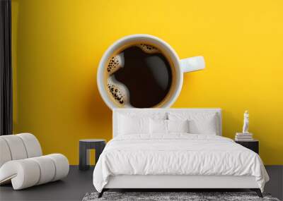 Top view of coffee cup on yellow and white background. Wall mural