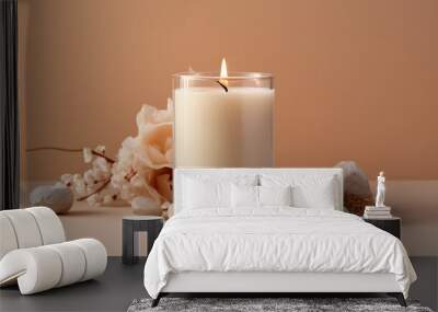 Vanilla burning candle on beige background. Warm aesthetic composition with stones and dry flowers. Home comfort, spa, relax and wellness concept. Interior decoration Wall mural