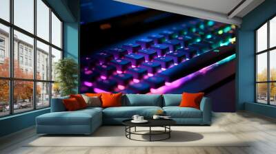 Working on a neon computer keyboard with colored backlighting. Computer video games, hacking, technology, internet concept. Selected focus. Wall mural