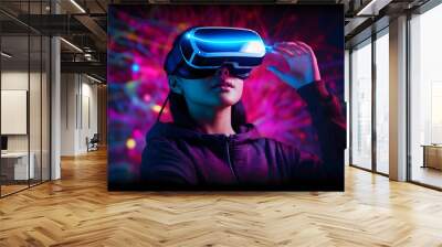 Young woman using glasses of virtual reality on dark background. Smartphone using with VR headset,virtual reality,future technology concept.Asian woman using VR glasses in colorful neon lights. Wall mural