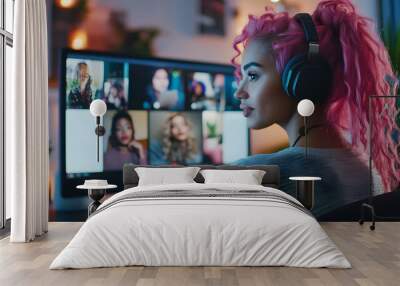 Young woman with pink hair working remotely on video team meeting call talking to colleagues, remote work and flexible culture concept, mixed race female digital nomad freelancing on home computer Wall mural