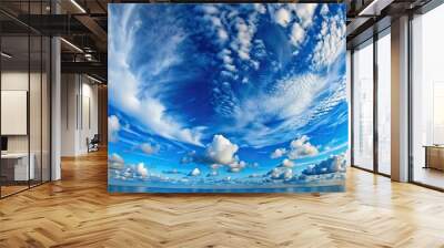 Fisheye view of blue summer sky with curly clouds Wall mural