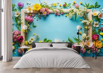 floral frame with spring flowers on blue background Wall mural