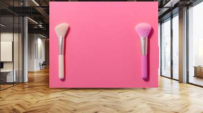 Make up brushes with powder on pink background Wall mural