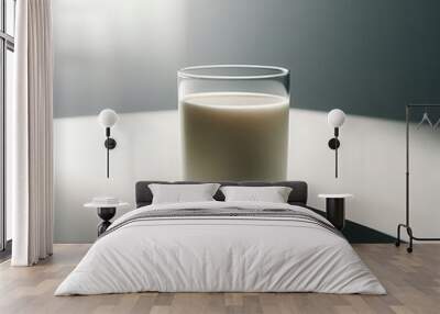 A glass of milk sits on a plain white table, illuminated by soft natural light from a nearby window.  Wall mural