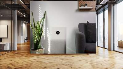 Air purifier with houseplant on the floor. Air pollution concept. Wall mural