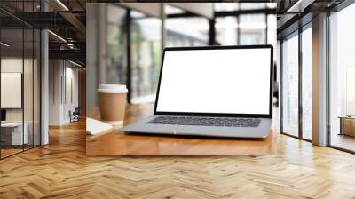 Close up view of computer laptop with blank screen on wooden table at modern office. Wall mural