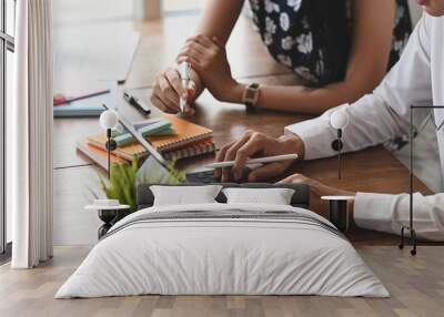 cropped image of graphic designer team working together by using a computer laptop and tablet with k Wall mural