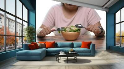 Cropped shot of overweight woman is eating vegetarian salad for weight loss and health. Wall mural