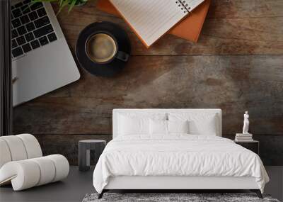 Flat lay office desk with laptop, notebook, pencil, plant and espresso on old rustic wood table. Wall mural