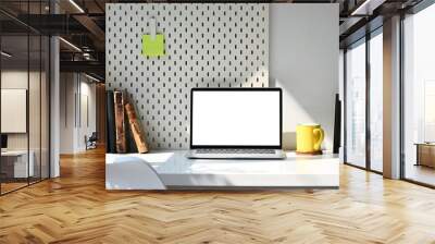 Front view computer laptop, stationery, books and picture frame on white table. Wall mural