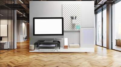 Front view of computer with blank screen, smart phone and office supplies at contemporary workplace. Wall mural