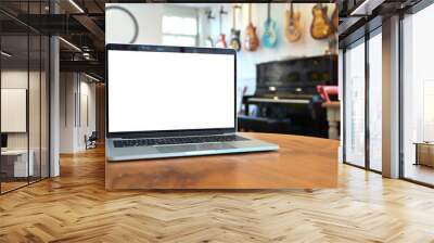 Mockup laptop computer on wood table at music house. Wall mural