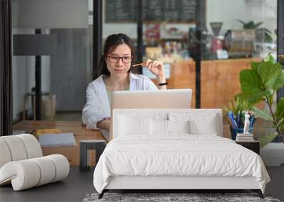 Successful businesswoman working with laptop computer. Wall mural