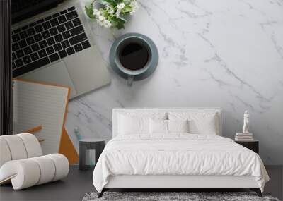 Top view image of marble table with accessories putting on it. Flat lay Computer laptop, Ceramic coffee cup, potted plant, notebook and pencil. Orderly/Comfortable workplace concept. Wall mural