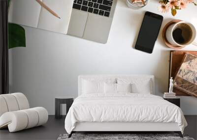 Top view office desk with computer, coffee mobile phone and office supply on table and morning windows light. Wall mural