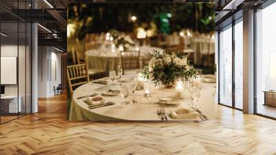 Served table for dinner on the wedding party at the hotel restaurant Table set up for a special event with roses and greenery outdoors Wedding table setting decorated with bouquets of white roses  Wall mural