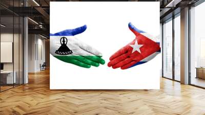 Handshake between Cuba and Lesotho flags painted on hands, isolated transparent image. Wall mural