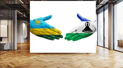 Handshake between Lesotho and Rwanda flags painted on hands, isolated transparent image. Wall mural