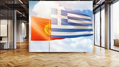 Sunny blue sky and flags of greece and kyrgyzstan Wall mural