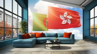 Sunny blue sky and flags of hong kong and algeria Wall mural