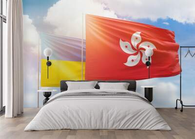 Sunny blue sky and flags of hong kong and ukraine Wall mural