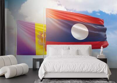 Sunny blue sky and flags of laos and andorra Wall mural