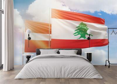 Sunny blue sky and flags of lebanon and latvia Wall mural