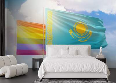 Sunny blue sky and flags of lgbt and kazakhstan Wall mural