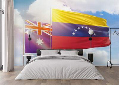 Sunny blue sky and flags of venezuela and australia Wall mural