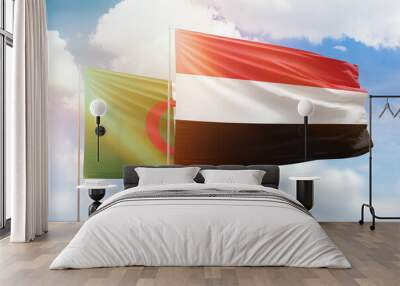 Sunny blue sky and flags of yemen and algeria Wall mural