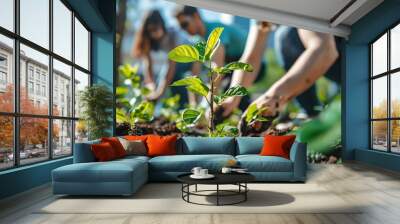 A group of entrepreneurs planting a tree in an urban setting, growth and sustainability in business Wall mural