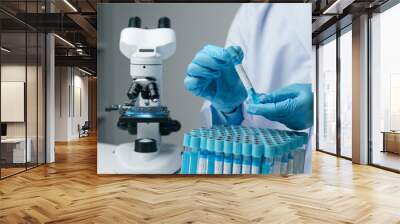 Scientists conducting research investigations in a medical laboratory. Scientist wearing medical gloves nanotechnology, research, fiber, microbiology, glass, test tube, medicine Wall mural