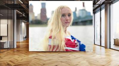 Serious Girl With American Flag Wrapped Around Her  Wall mural