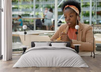 Businesswoman working during lunch Wall mural