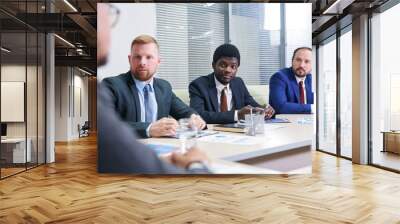 Group of confident financial directors having meeting in boardroom Wall mural