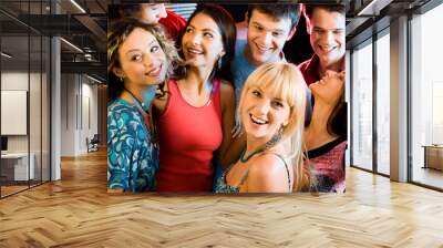 Happy group of people having an evening-party Wall mural