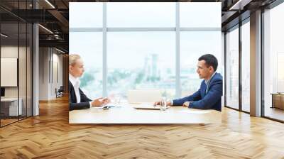 profile view of two business people, man and woman, representing sides of contract, sitting opposite Wall mural