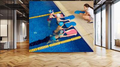 Swimmers with coach Wall mural