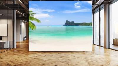 Panorama of longtail boats, coconut palm tree and blue water at Loh Dalum Beach in Ko Phi Phi Don Island, Thailand. Wall mural