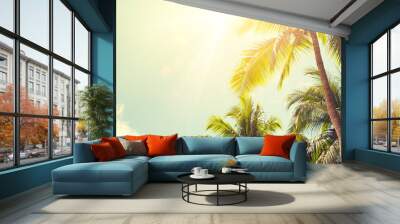 Panorama of tropical palm tree with sun light on sky background. Wall mural