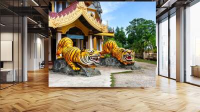 Statues of tigers at entrance to buddhist pagoda Tham Sua near Tiger Cave Temple in Krabi, Thailand Wall mural