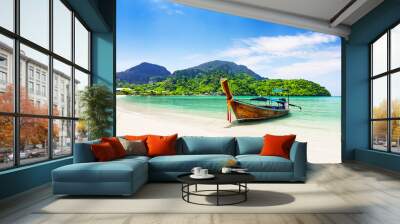 Thai traditional wooden longtail boat and beautiful sand beach. Wall mural