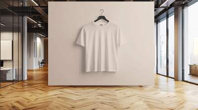 A plain white t-shirt hanging on a minimalist hanger, isolated on a neutral background, perfect for showcasing custom designs or branding. Wall mural